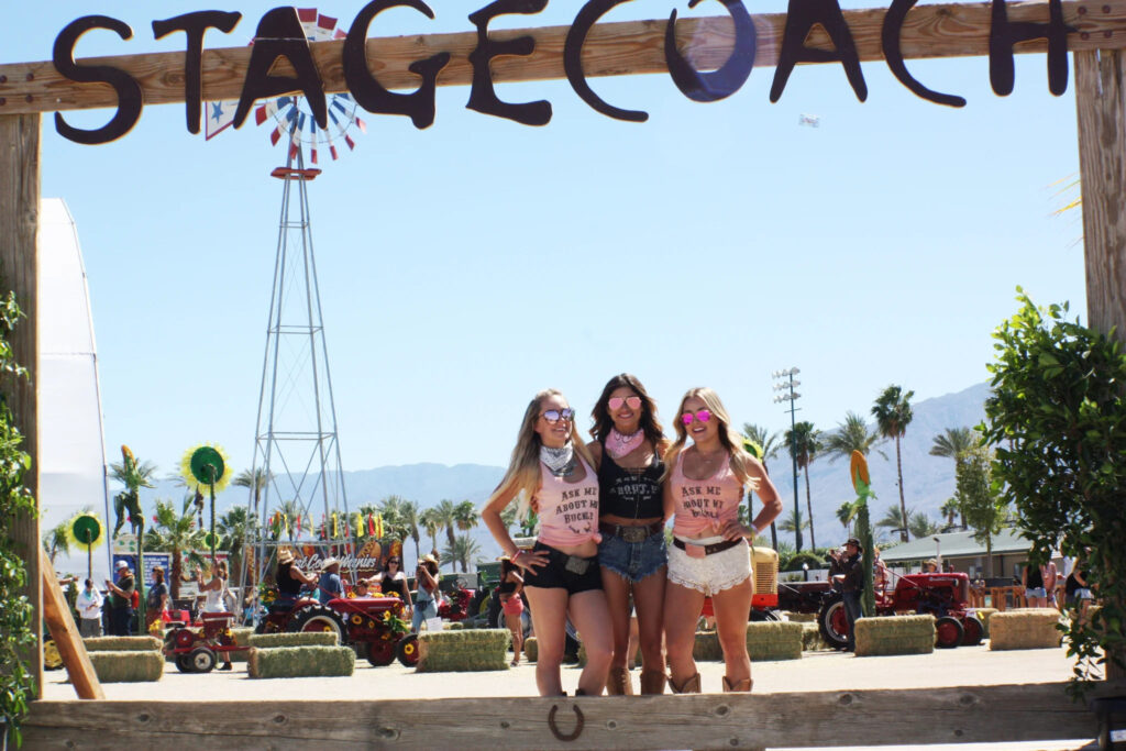Three girls posing for a picture at the Stagecoach Festival